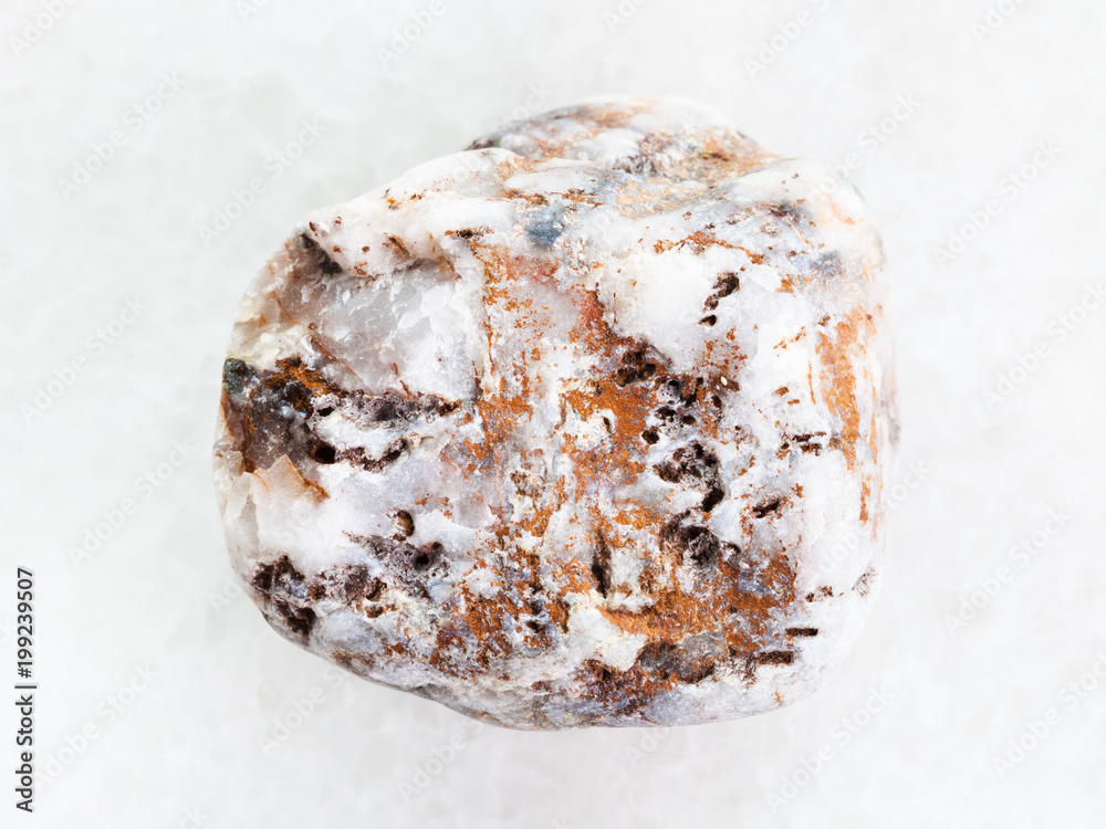 marble pebble on white marble background marble pebble on white marble background