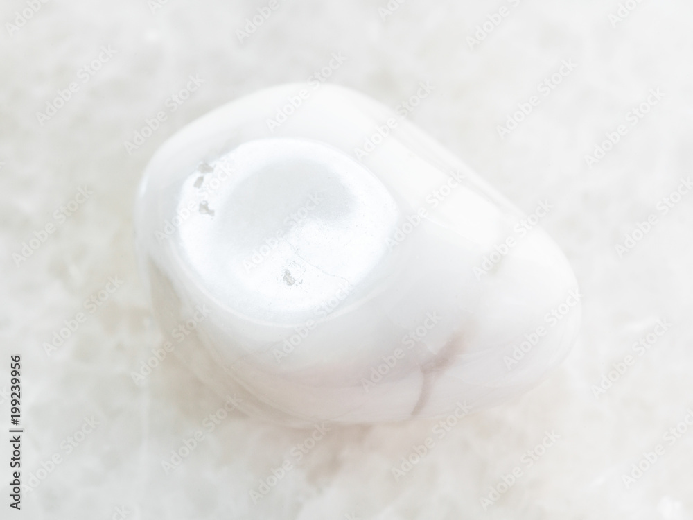 tumbled magnesite gemstone on white marble tumbled magnesite gemstone on white marble
