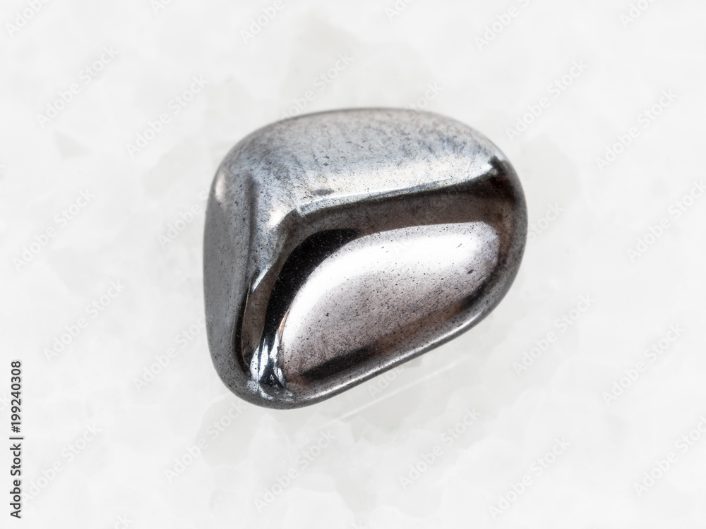 polished hematite gem on white marble polished hematite gem on white marble