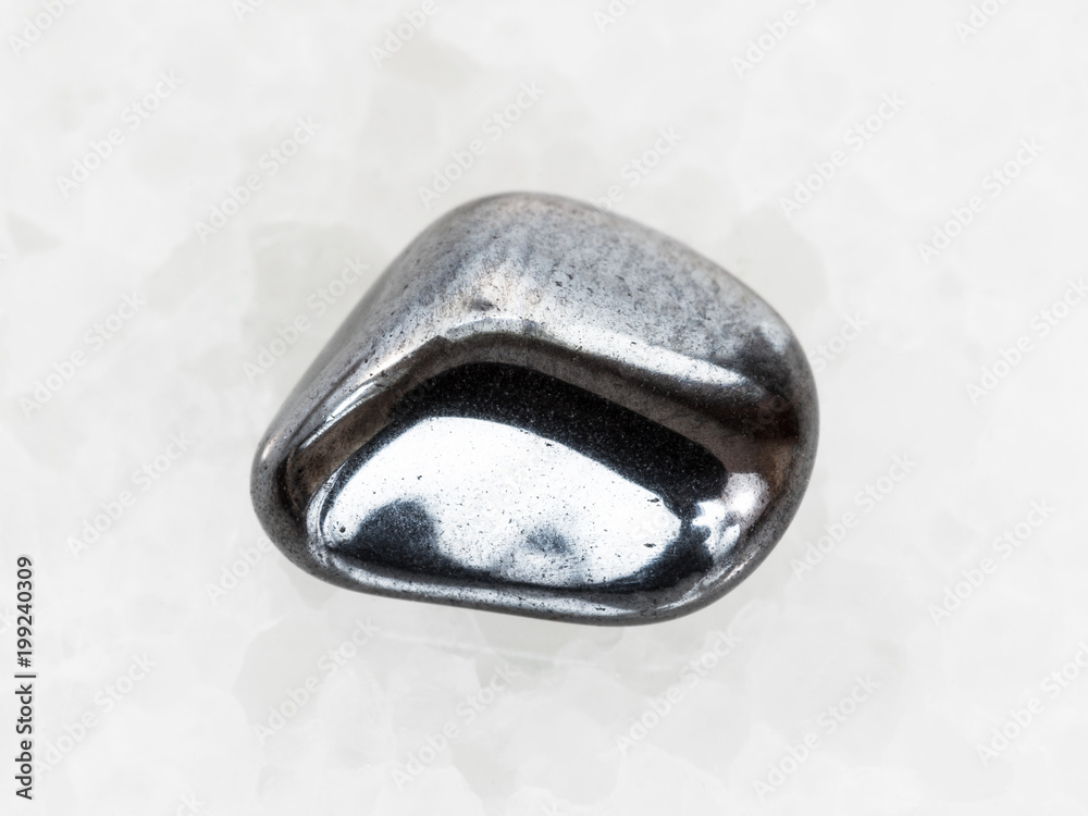 tumbled hematite gem on white marble tumbled hematite gem on white marble