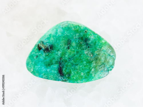 piece of green Agate gemstone on white marble