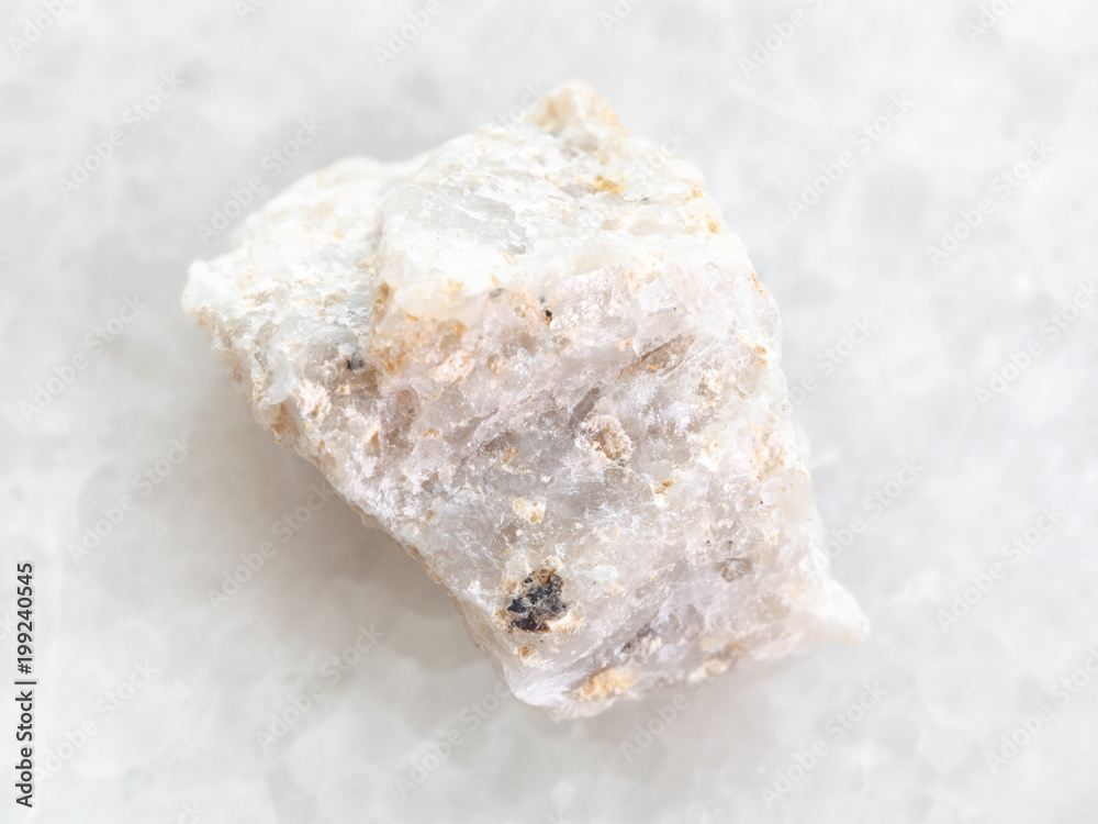 raw Conglomerate stone on white marble raw Conglomerate stone on white marble