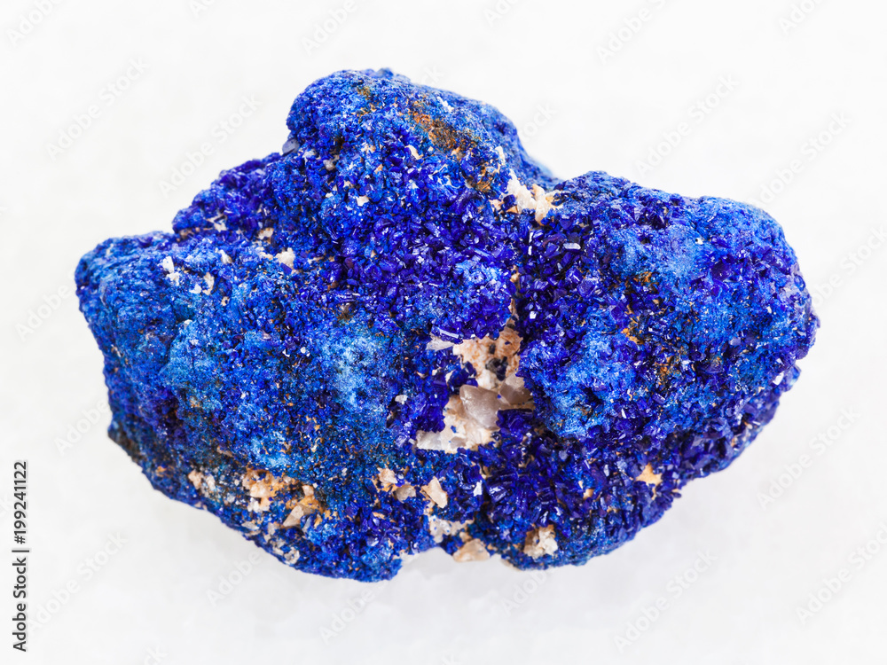 rough crystalline Azurite stone on white marble rough crystalline Azurite stone on white marble