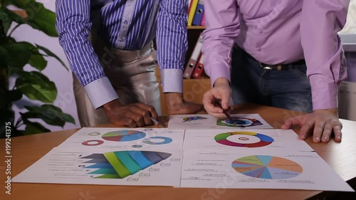 Two businessmen discuss the business project