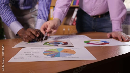 Two businessmen discuss the business project