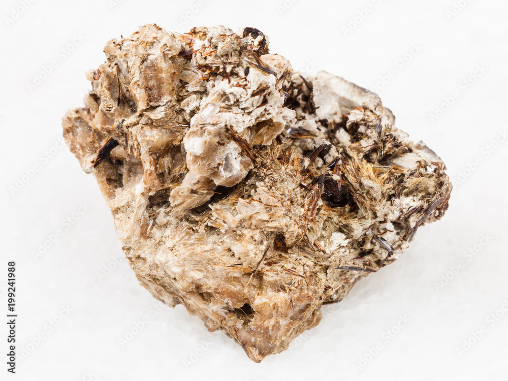 Astrophyllite crystals in Natrolite stone on white Astrophyllite crystals in Natrolite stone on white