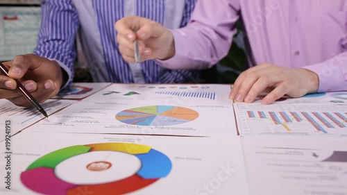 Two businessmen discuss the business project