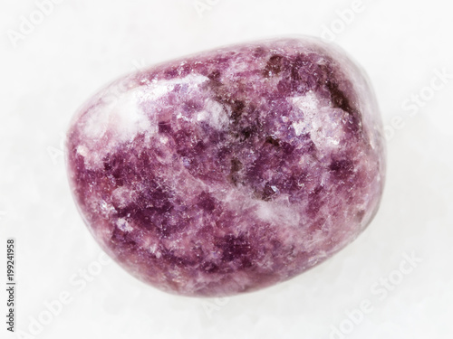 tumbled Lepidolite gemstone on white