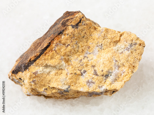 raw Narsarsukite stone on white