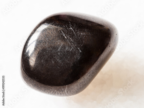 tumbled Gagate (Jet) gem stone on white photo