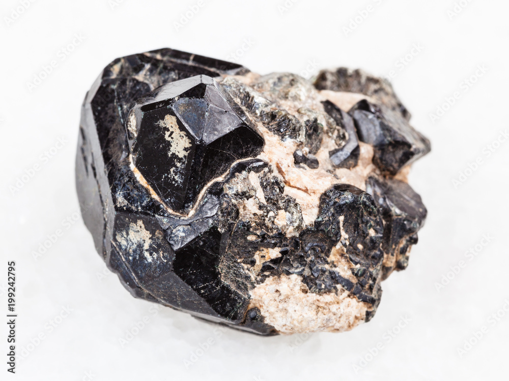 crystal of Spinel gemstone on black Diopside