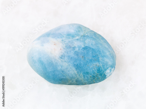 polished aquamarine gem stone on white