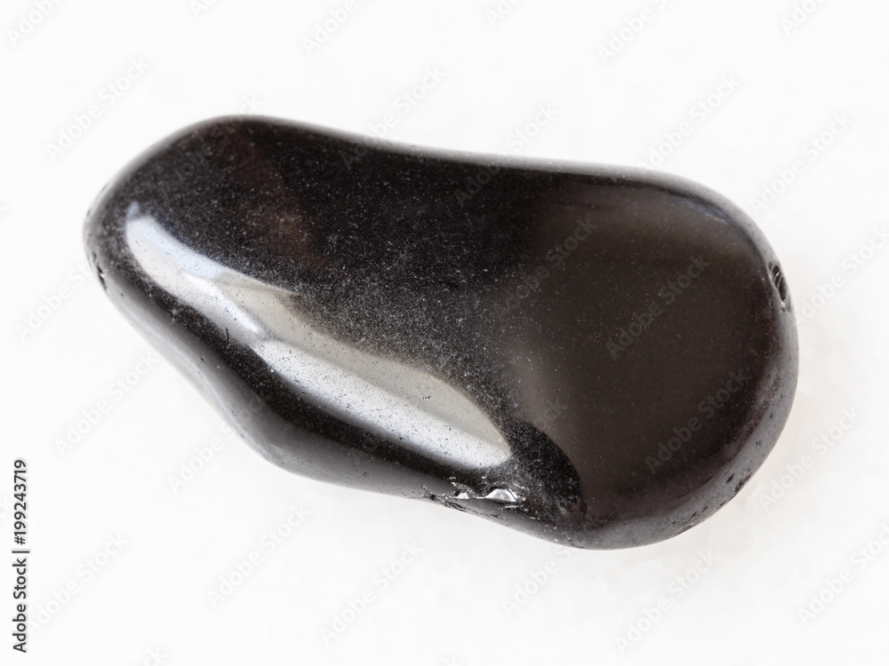 tumbled black obsidian gemstone on white tumbled black obsidian gemstone on white