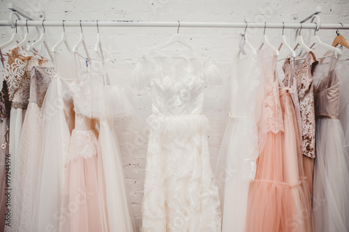 White modern wedding dresses in dress store.