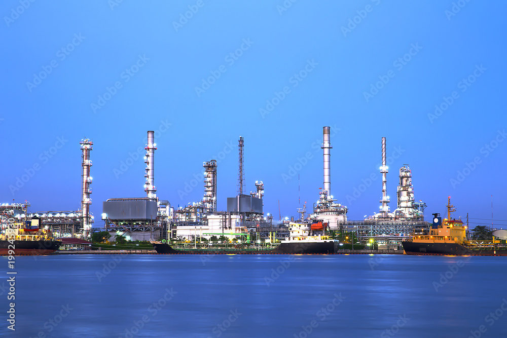 Oil and Gas Refinery plant industry factory with river on twilight time Oil and Gas Refinery plant industry factory with river on twilight time