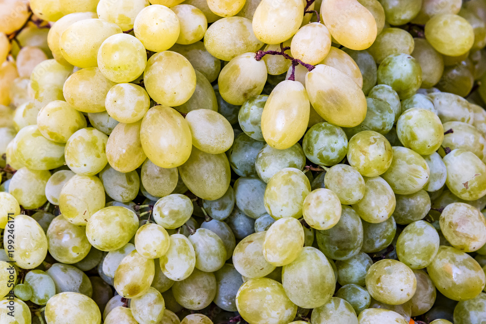 Closeup of ripe grape. Pile of ripe grape display at market. Closeup of ripe grape. Pile of ripe grape display at market.