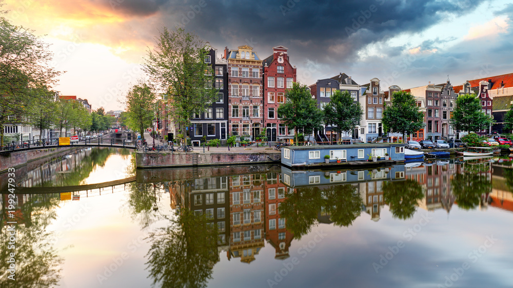 Traditional Dutch old houses on canals in Amsterdam, Netherland.