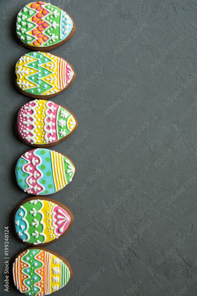 gingerbread cookie in the form of color eggs on background.
