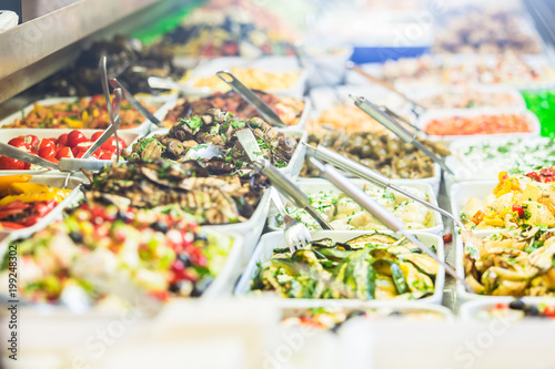 Display with Meze appetizers in delicatessen shop photo