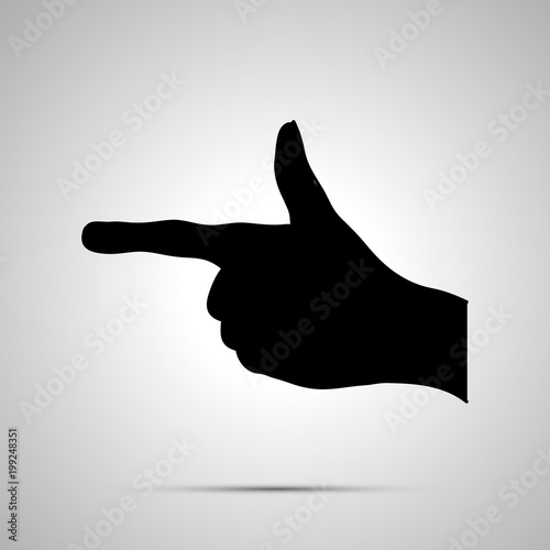 Black silhouette of hand in pointing gesture on white