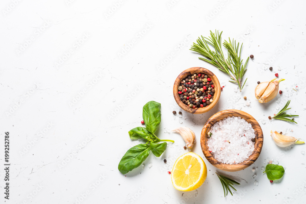 Spices and herbs over white stone table top view. - obrazy, fototapety, plakaty 