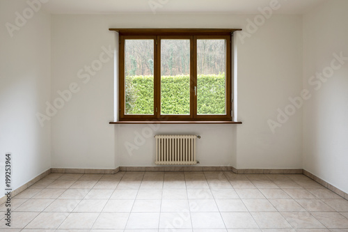 Empty room and window overlooking the garden