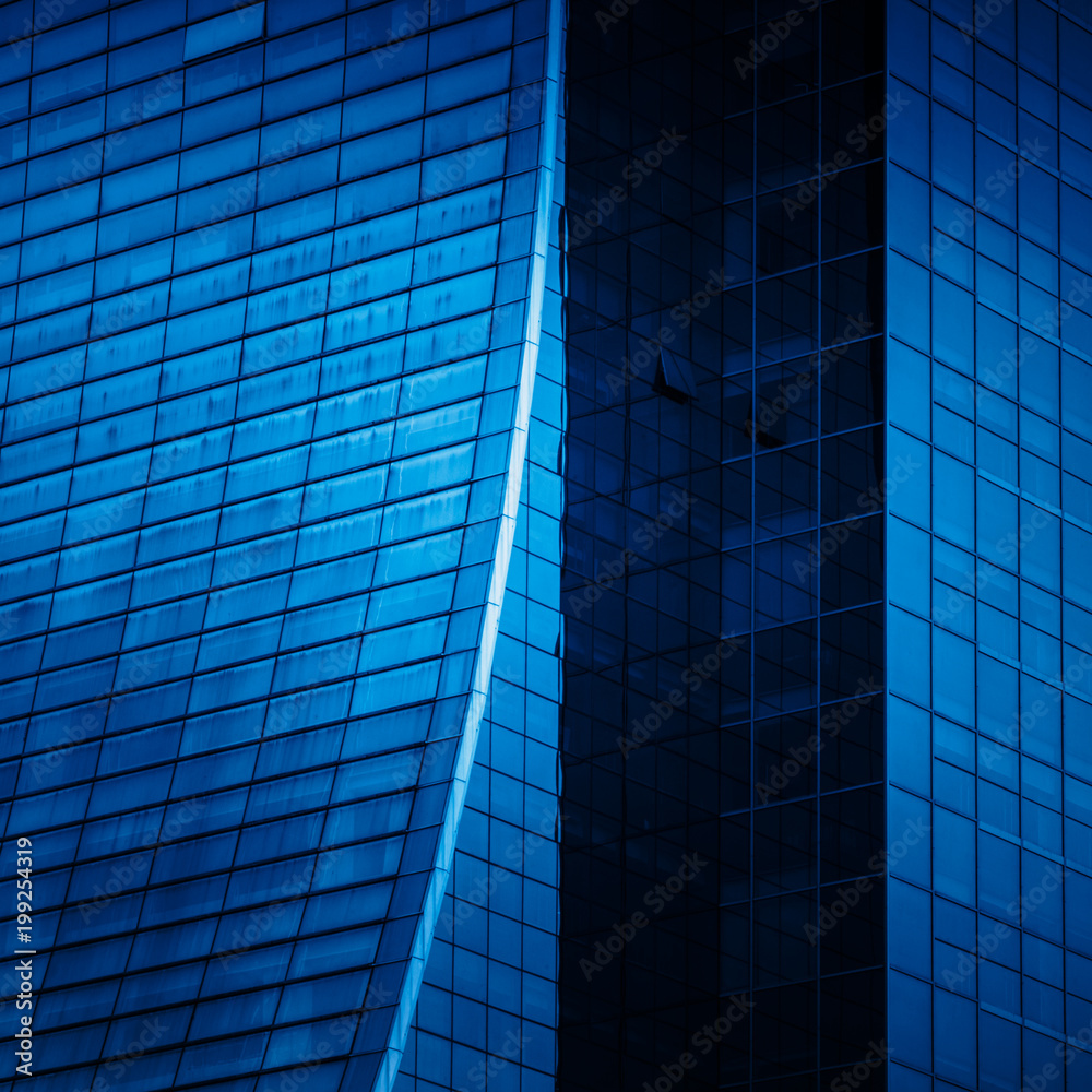 Obraz premium full frame of modern glass building,blue toned.