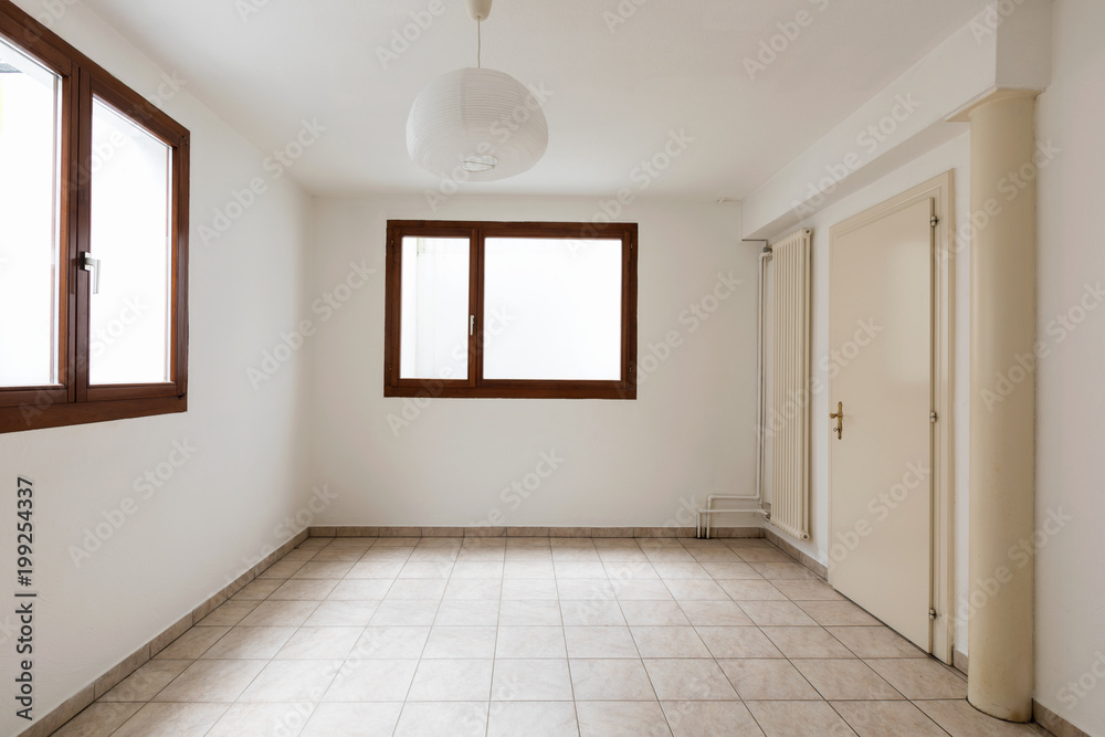 Large empty room with windows Large empty room with windows