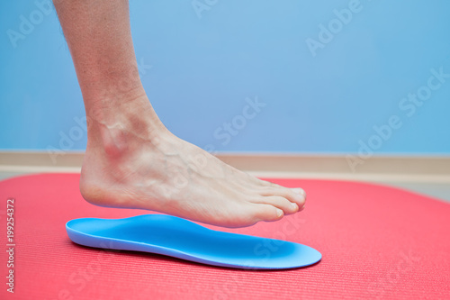 Foot on orthopedic insoles medical foot correction photo