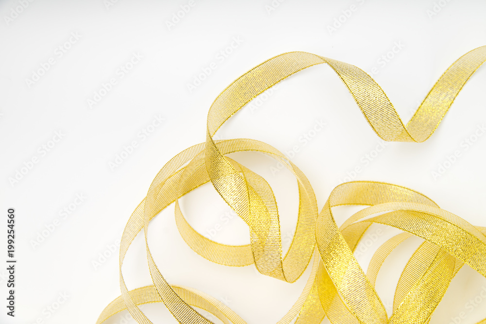 Shiny golden ribbon winded in spiral pattern on white background. Backdrop for text or announcement Shiny golden ribbon winded in spiral pattern on white background. Backdrop for text or announcement