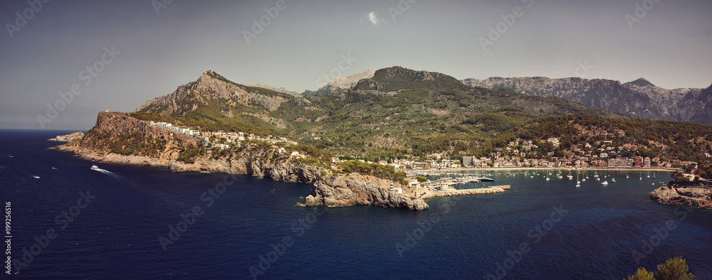 A panorama of Port de Soller, Mallorca with mountains in background
