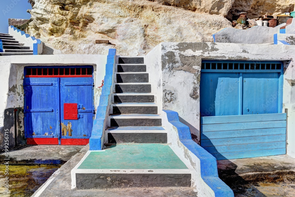 Naklejka premium Boat houses in the harbour of Mandrakia village on the northern coast of Milos Island, Greece
