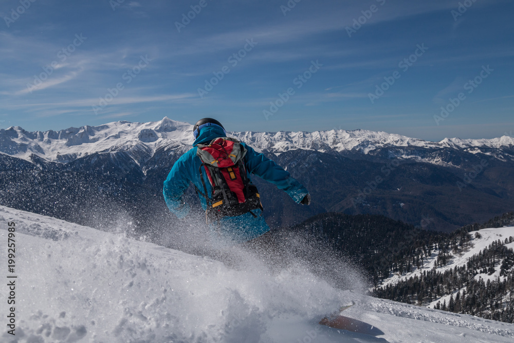 girl snowboarder rides fast on loose snow Freeride