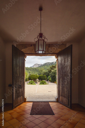 Open wooden gateway door of Lluc Santuary in Mallorca