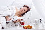 woman morning breakfast reading book white bed