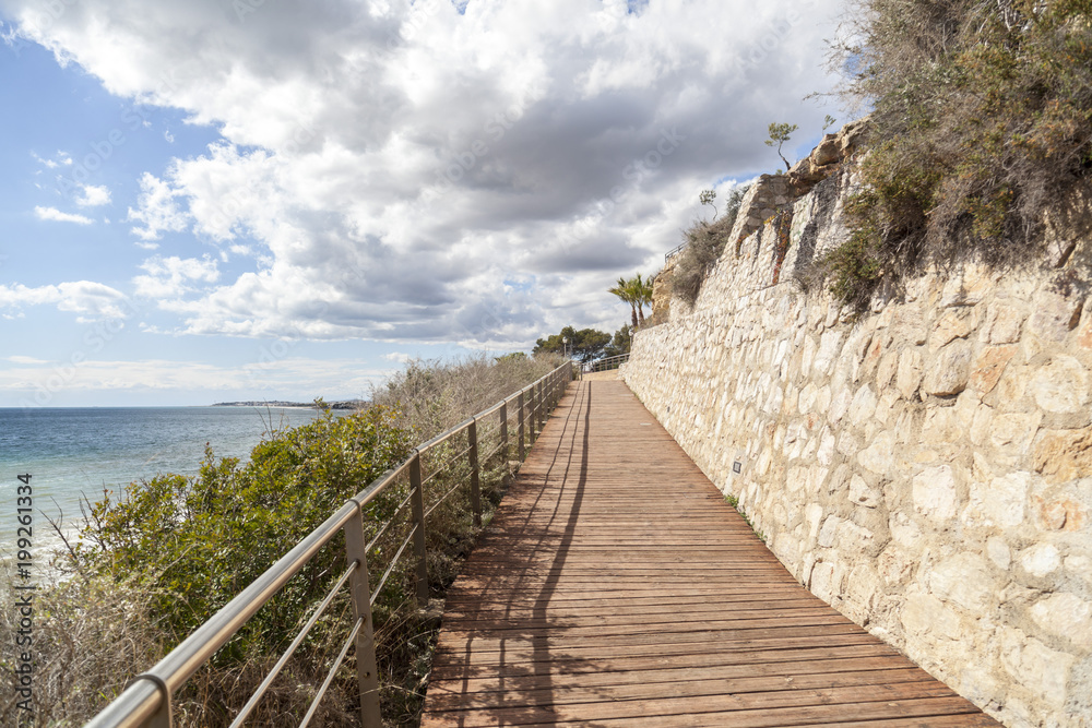Footpath, Cami de Ronda close to Mediterranean sea in Roda de Bera, Costa Dorada, Catalonia, Spain. Footpath, Cami de Ronda close to Mediterranean sea in Roda de Bera, Costa Dorada, Catalonia, Spain.