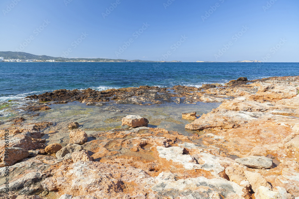 Mediterranean sea, coastal view, rock formation, town of Sant Antoni, Ibiza Island,Spain.