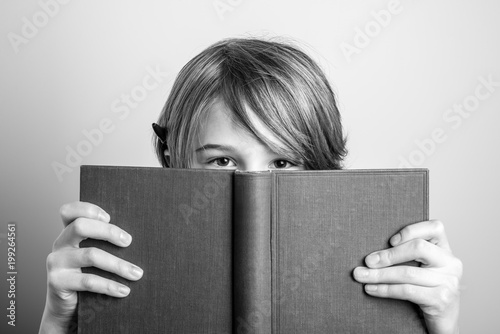young blonde smiling guy with book - black and white photo