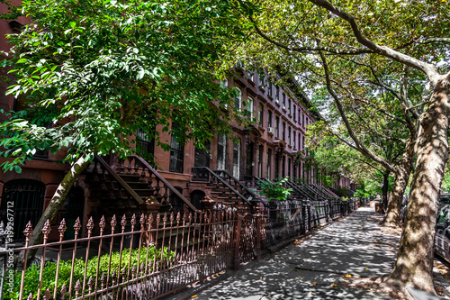 Canvastavla Brownstone Homes along residential Neighbourhood sidewalk in Brooklyn New York