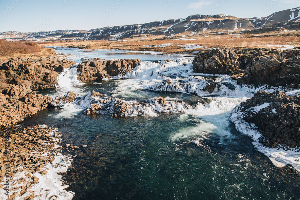 majestic icelandic landscape with hills and rapid river at sunny day, Hraunfossar, iceland majestic icelandic landscape with hills and rapid river at sunny day, Hraunfossar, iceland