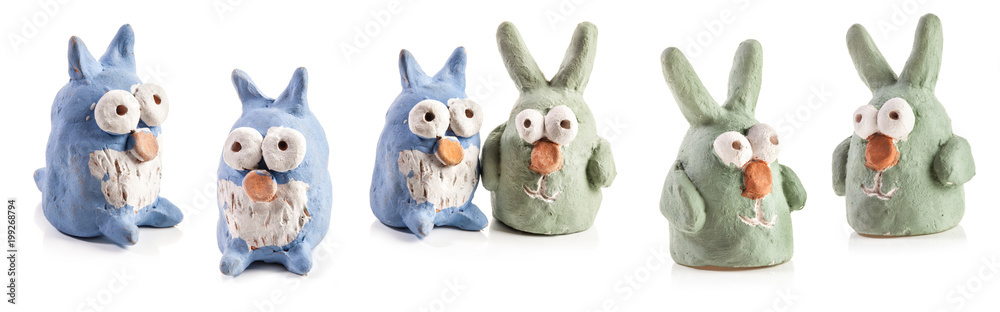 Naklejka Rabbits and owls figurines from clay made by children