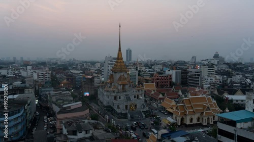 Dusk to night Traimit Wittayaram Temple in Bangkok's Chinatown, Thailand. photo