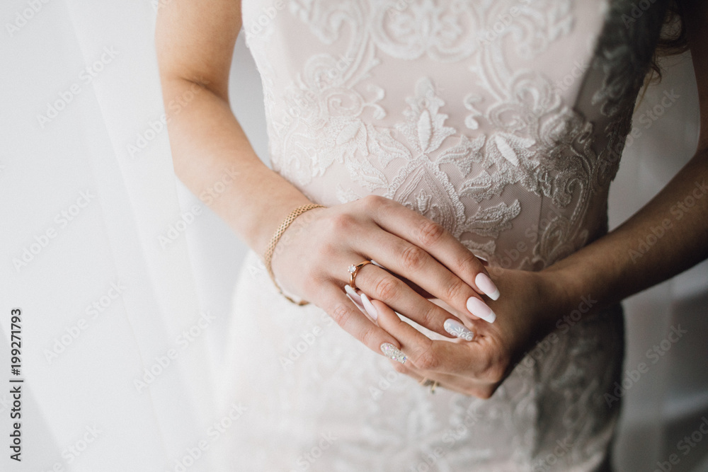 Gorgeous, blonde bride in white luxury dress is getting ready fo Gorgeous, blonde bride in white luxury dress is getting ready fo