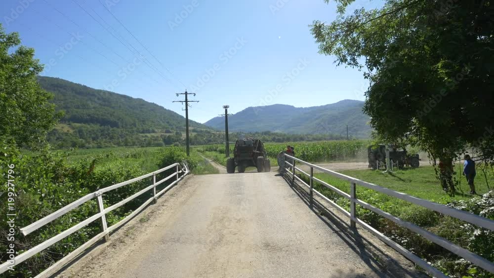 Offroad car crossing a bridge Offroad car crossing a bridge