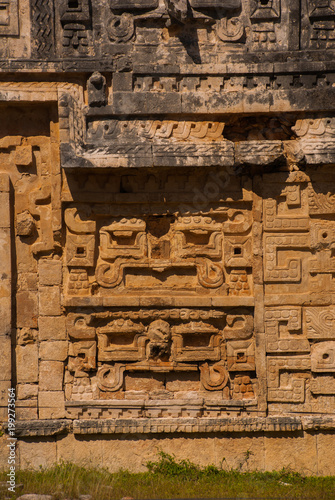 Ancient Mayan drawings on stone. The texture of the stone. Chichen-Itza, Mexico. Yucatan photo