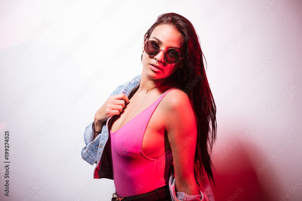 Pretty casual woman pink top in sunglasses