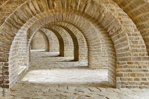 archway with many stone arches, antique tunnel