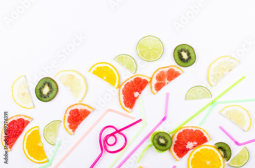 Flat lay citrus slices and straws