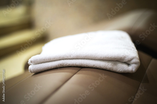 Canvas-taulu towel in the spa center on the sunbed close