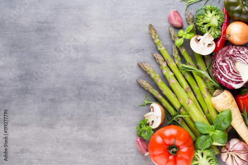 Flat lay of various colorful raw vegetables.